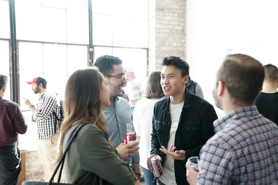People talking at a daytime meetup
